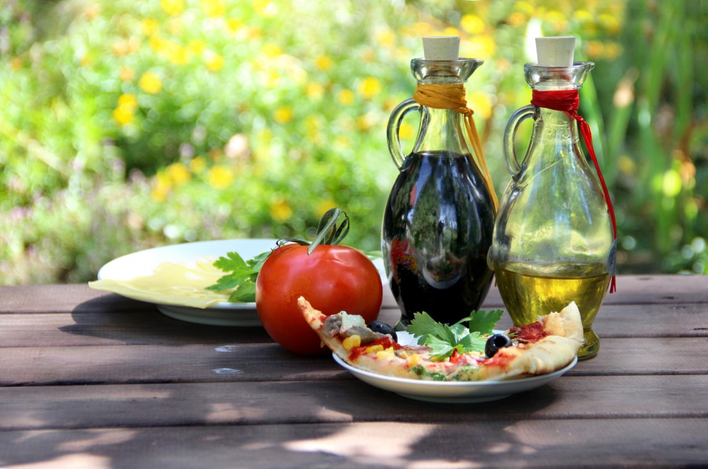 Piece of pizza in the summer garden table