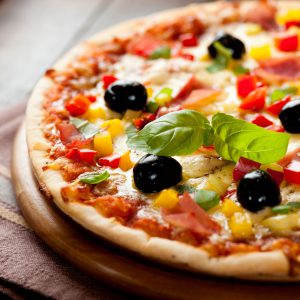 Pizza with ham, pepper and olives